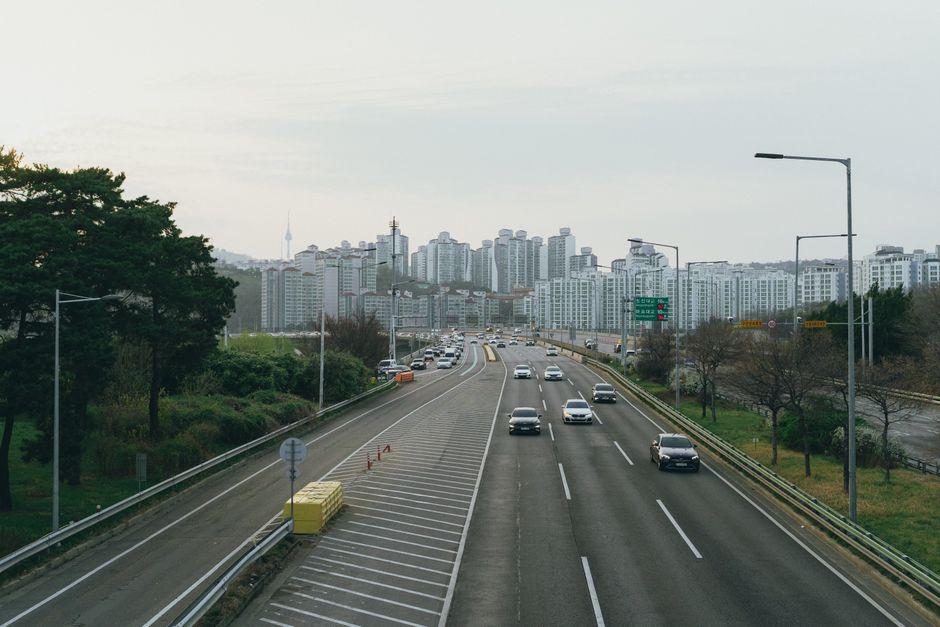 Korean expressway heading south from Seoul toward Chungcheong province on a clear day