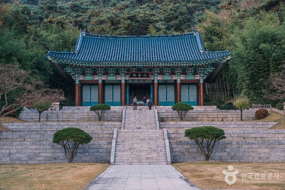 Traditional Korean shrine gate at Hyeonchungsa surrounded by pine trees in Asan