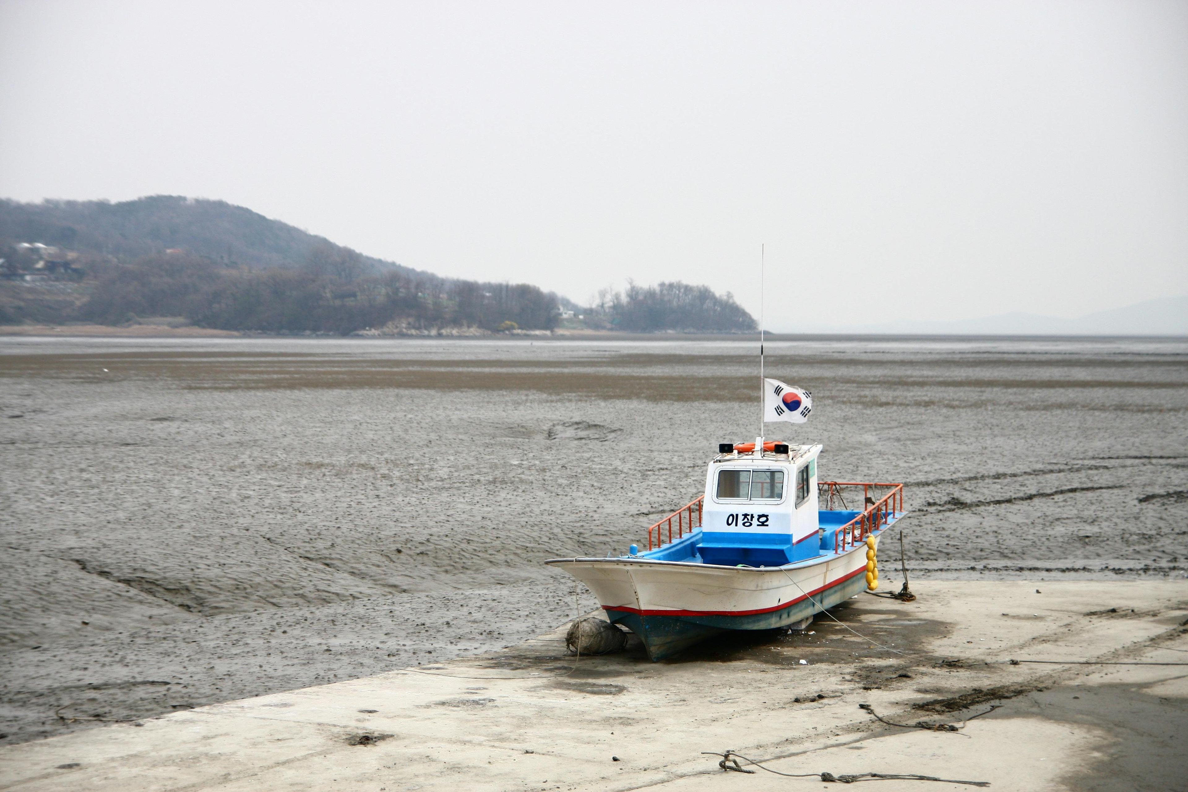 A fishing boat rests on the tidal flat of Ganghwa Island South Korea