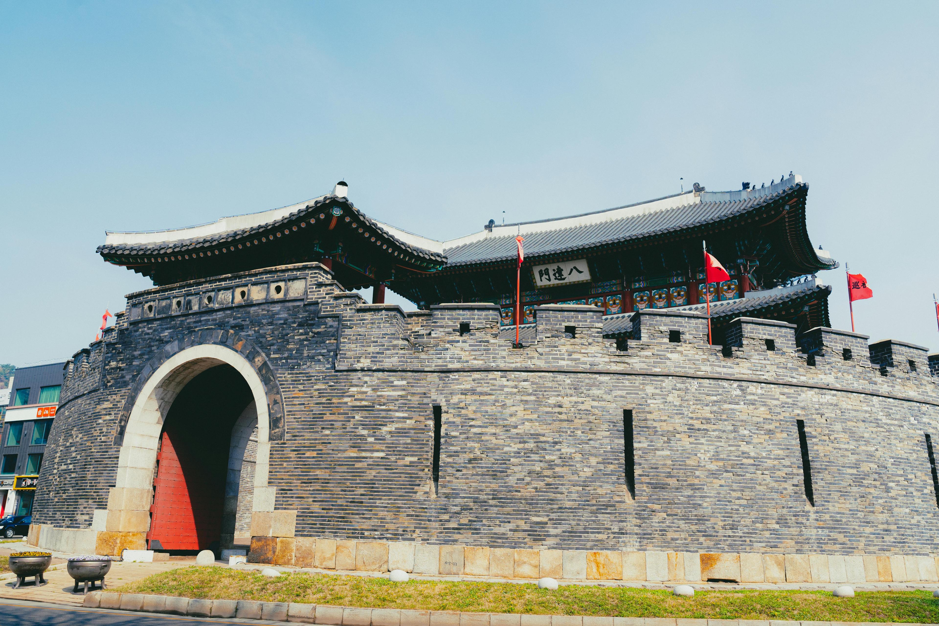 Vivid view of the Hwaseong Fortress in Suwon showcasing traditional Korean architecture