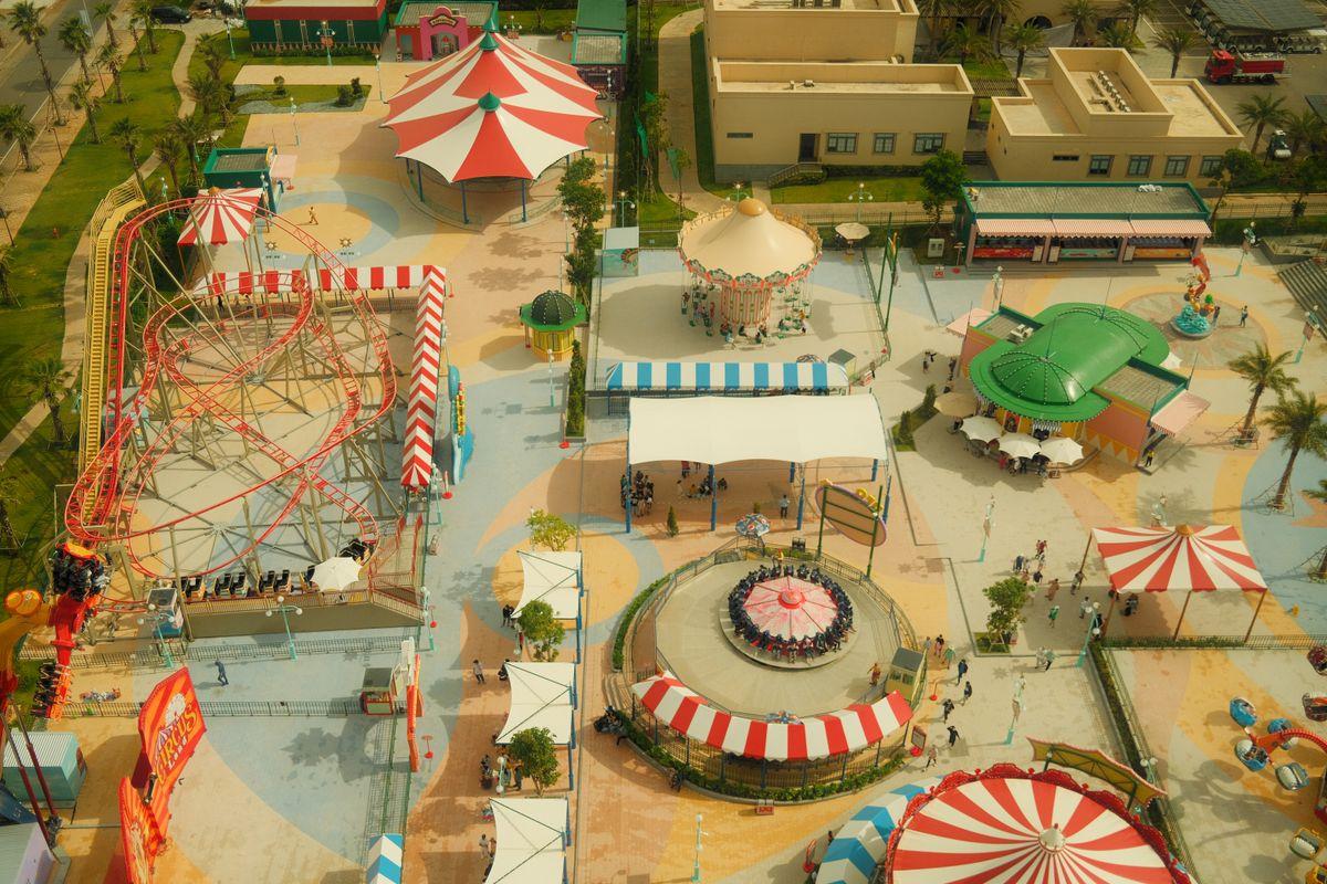 Colorful theme park rides and attractions lit up at a Korean amusement park