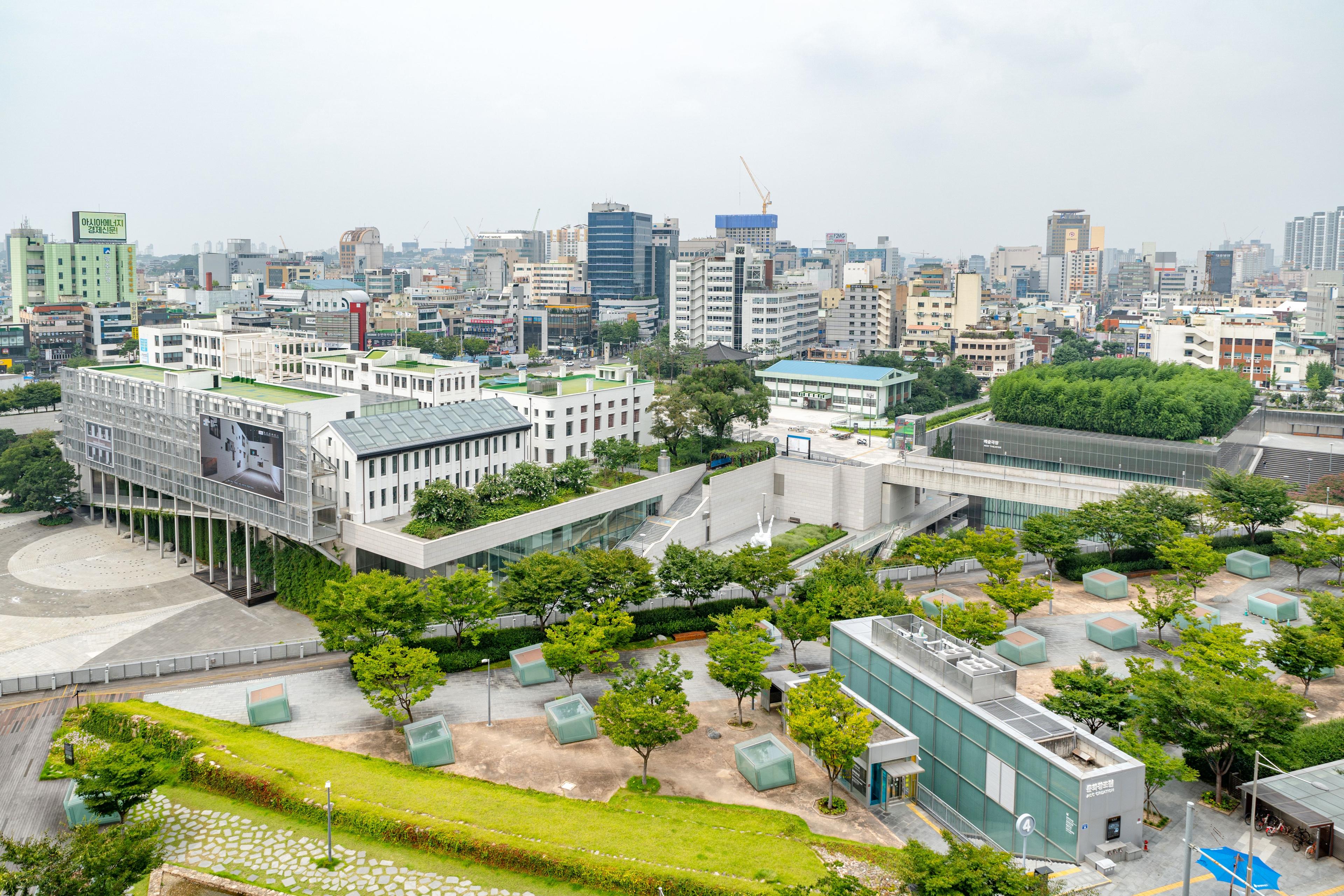 Aerial view of Gwangju cityscape showcasing modern architecture of the Asia Culture Center and green urban spaces