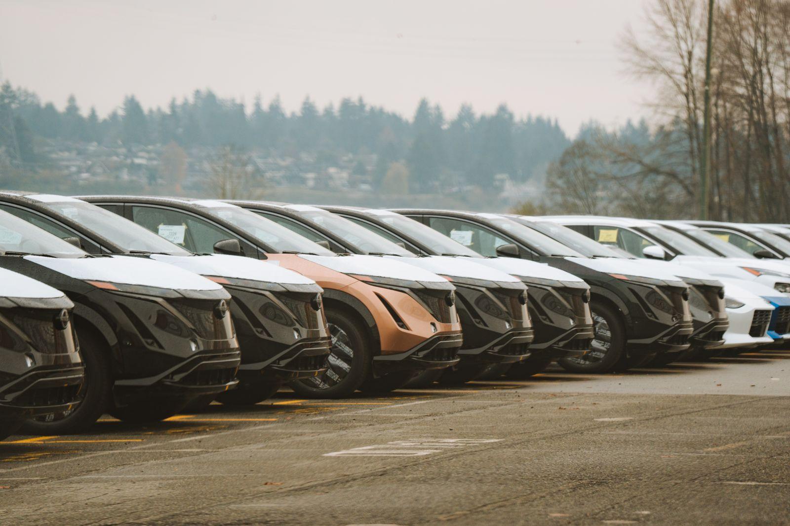 Row of electric rental cars parked at a Korean car rental lot