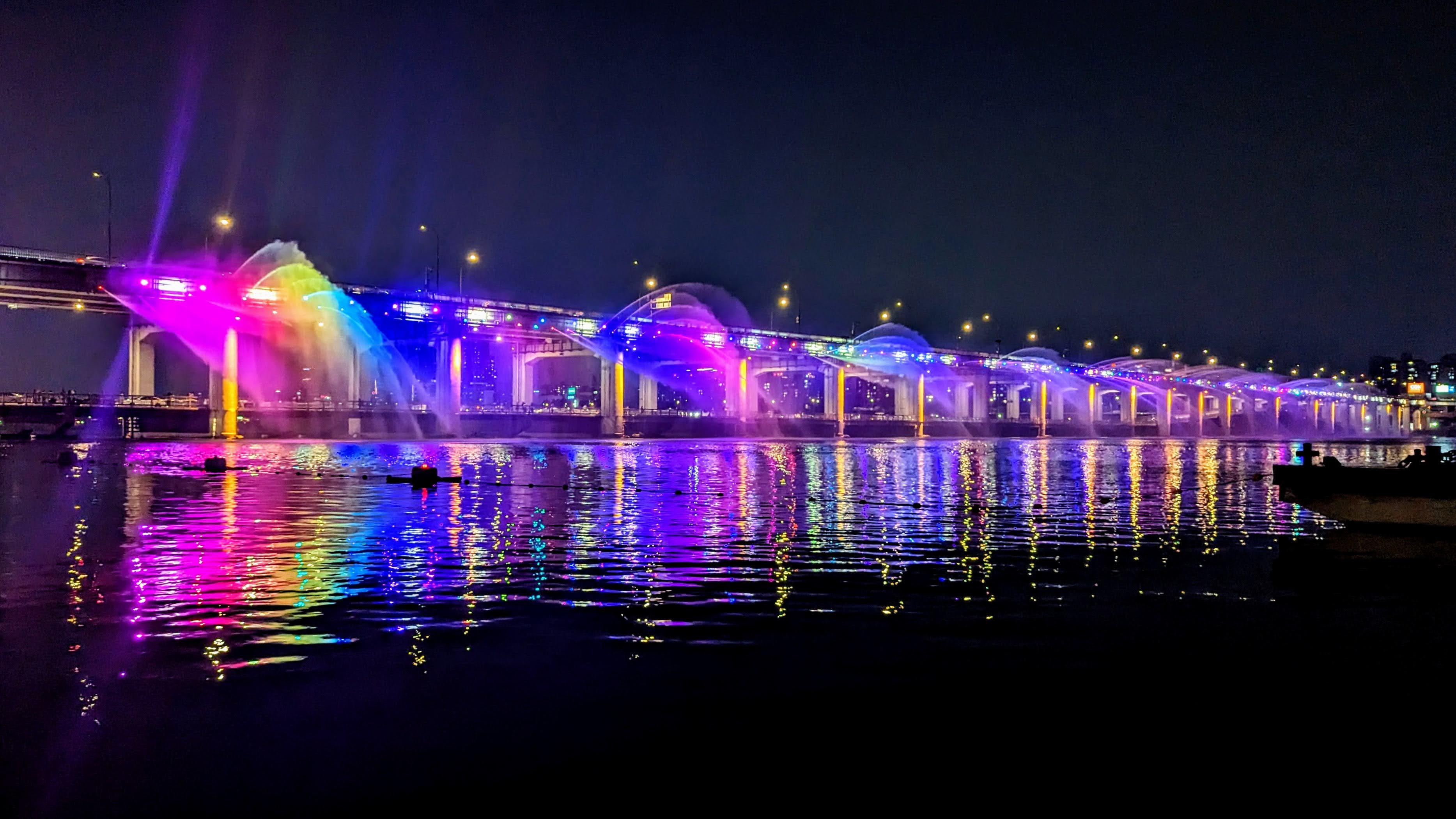 Banpo Bridge Moonlight Rainbow Fountain illuminated at night over the Han River in Seoul