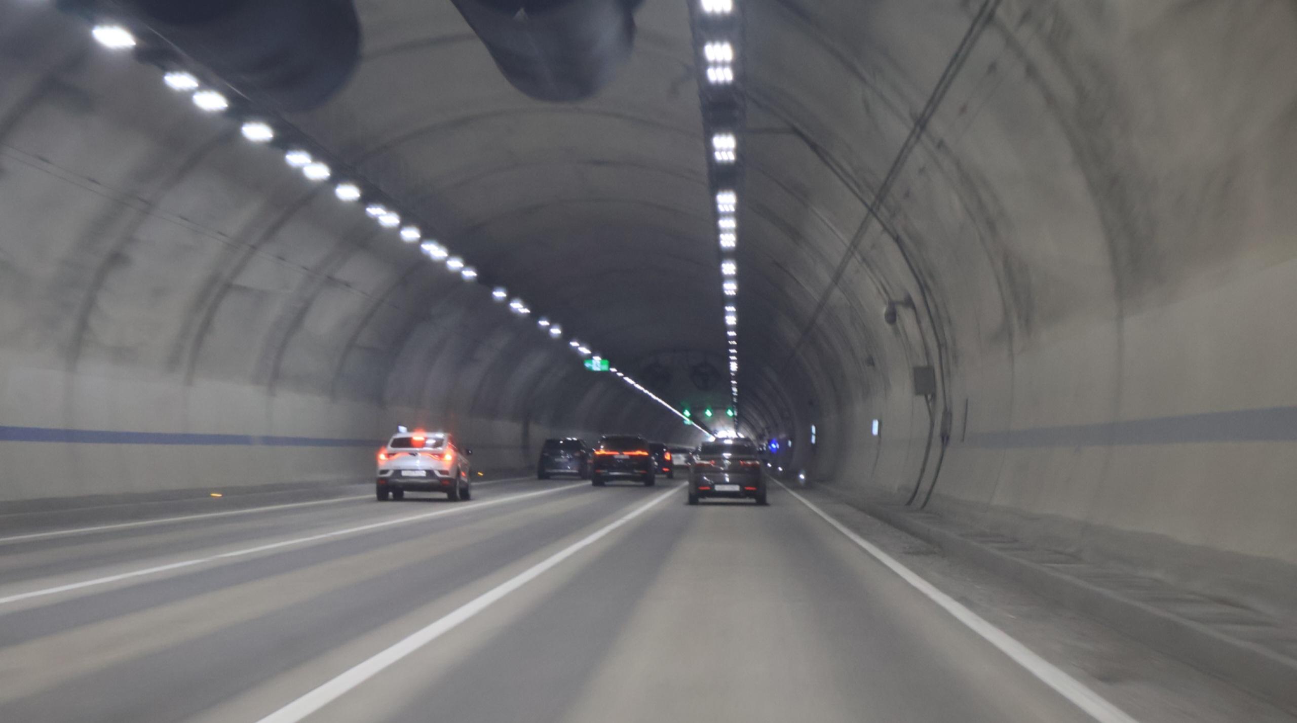 Interior of a long tunnel on a South Korean expressway with overhead lighting
