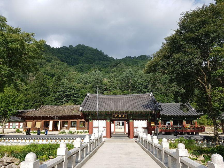 Traditional Korean temple gate at entrance to forest hiking path in national park