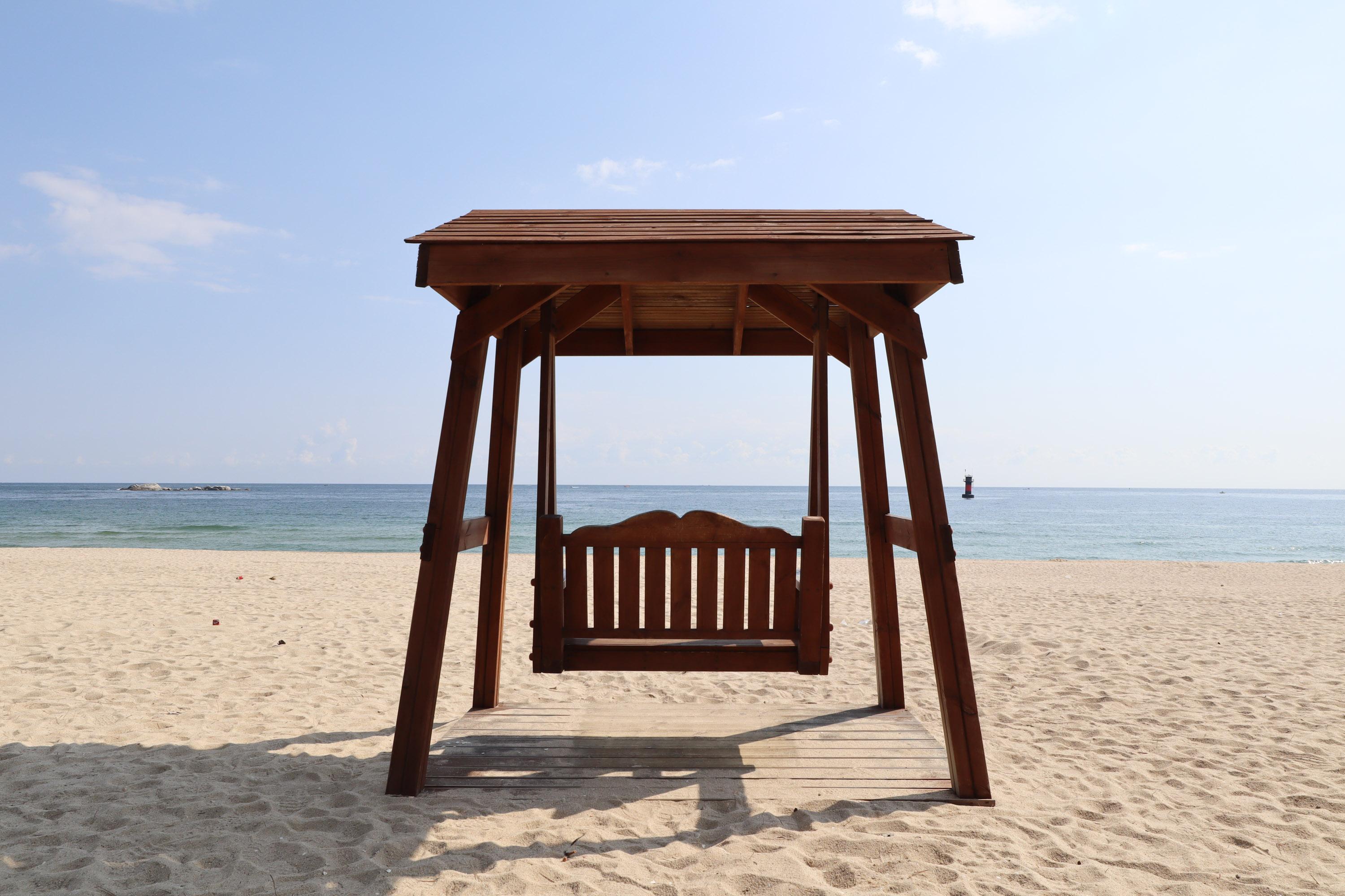 Gyeongpo Beach in Gangneung, Korea with wide sandy shore and pine forest backdrop