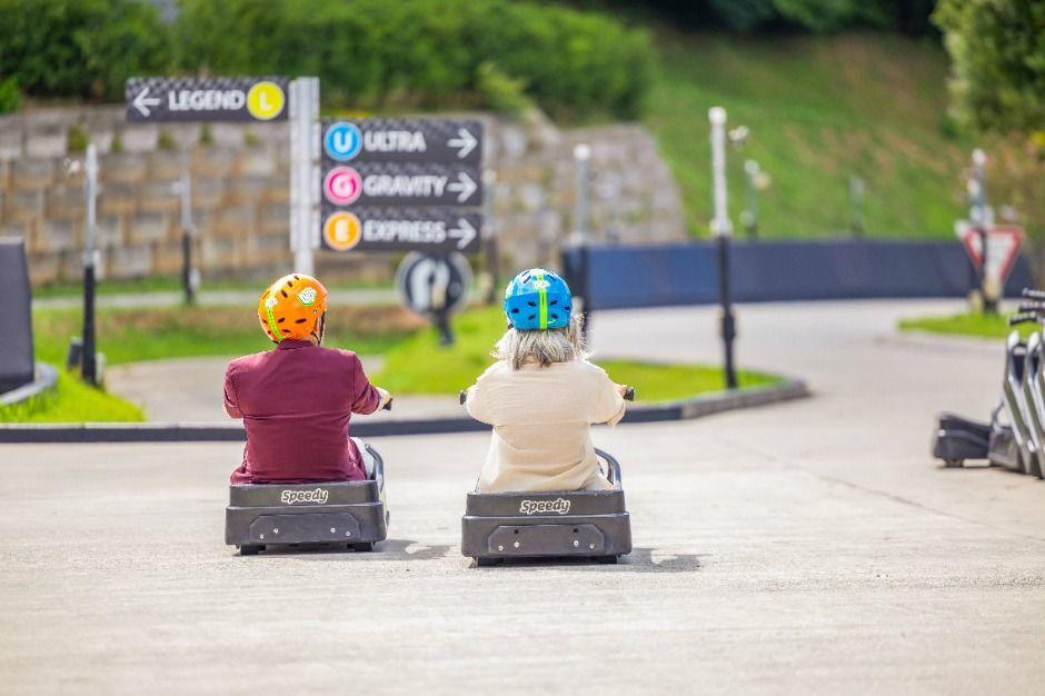 Skyline Luge Tongyeong gravity cart track descending hillside with ocean views