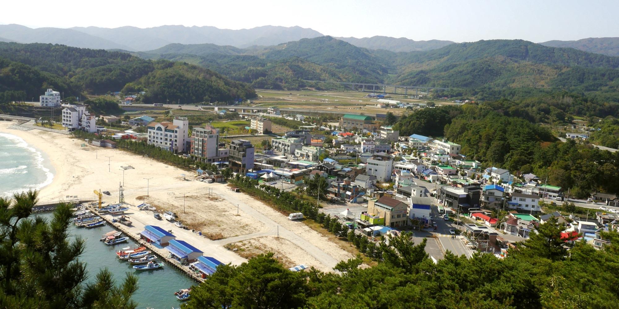 Gangwon Province east coast of Korea — open ocean and forested headlands on Route 7