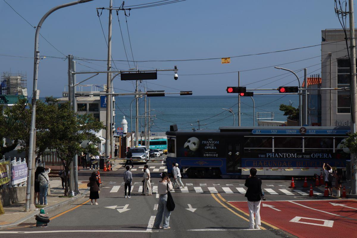 Tourist train crossing at Cheongsapo station near the fishing village, Busan South Korea