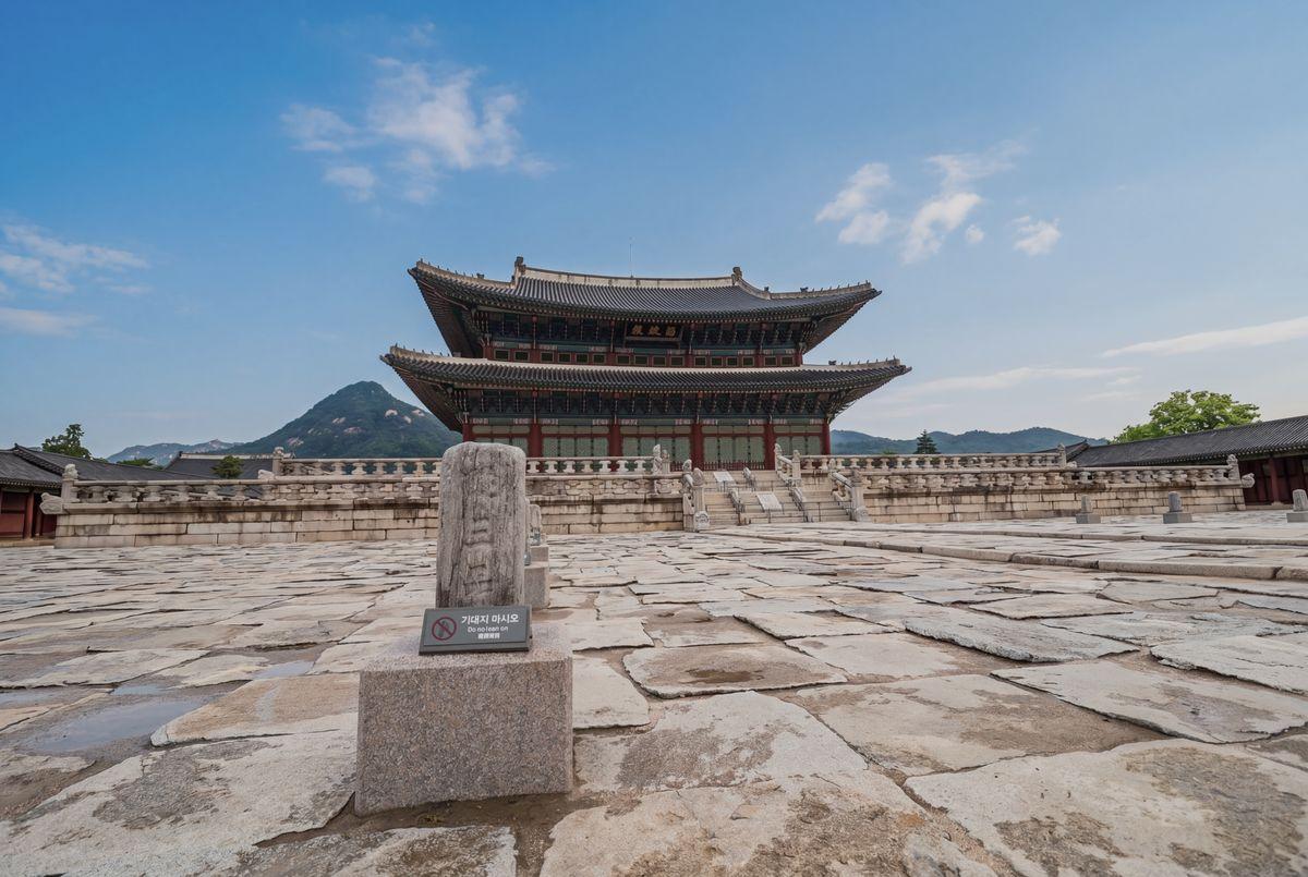 Aerial view of Gyeongbokgung Palace grounds with mountains in the background, Seoul