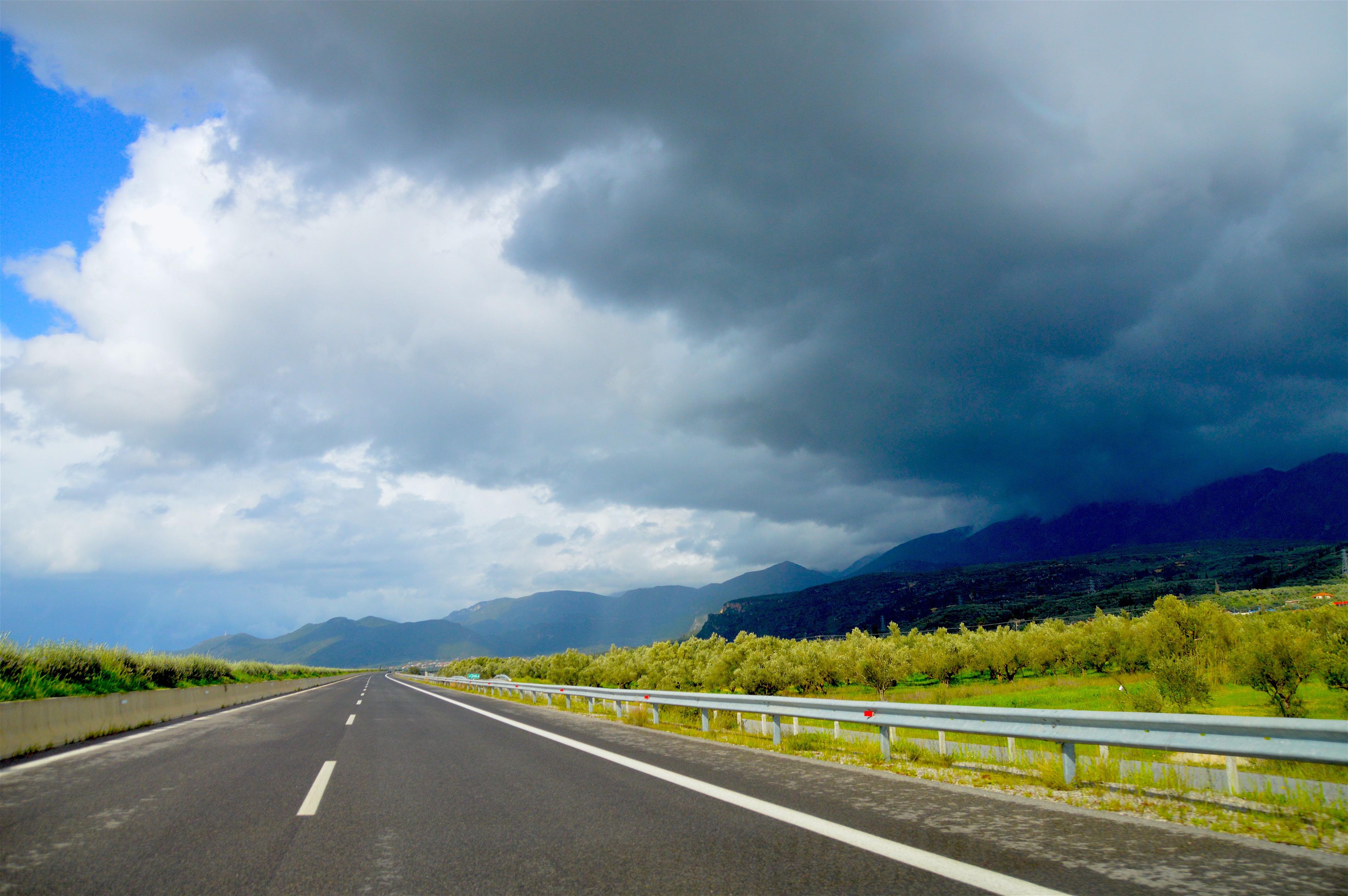 Dark storm clouds gathering over a Korean expressway ahead of typhoon season