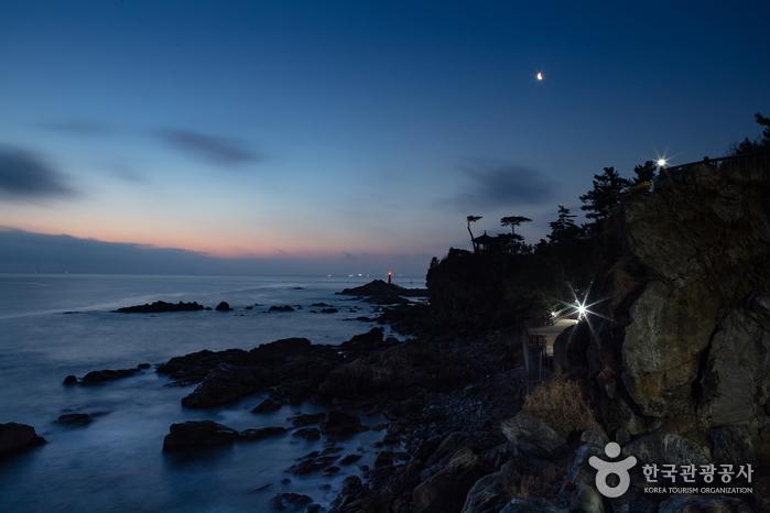 Naksansa Temple complex with the white Haesugwaneumsang statue overlooking the East Sea at sunrise
