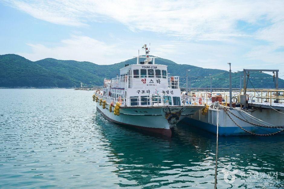 Ferry cruise boat departing Gujora Harbor for Oedo Island near Geoje, South Korea