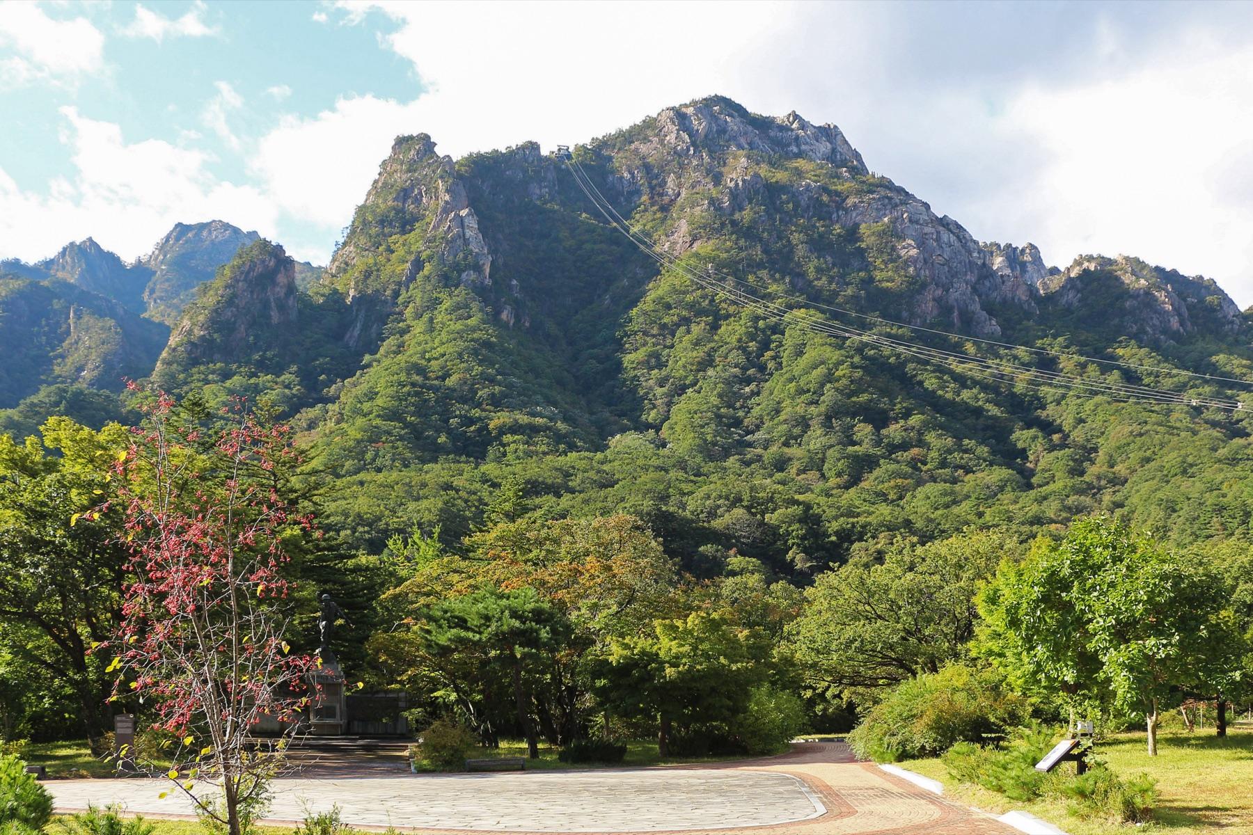 Seoraksan cable car gondola ascending the mountain with granite peaks in background